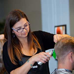 Woman Cutting Man's Hair